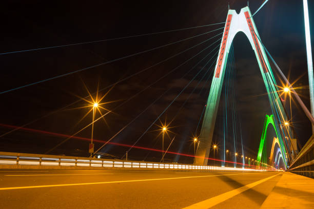 istock Long exposure Nhat Tan cable stayed bridge at night. The bridge crossing Red River 641831088