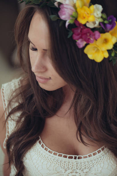 istock Young Bride portrait with spring flower wreath 641831300