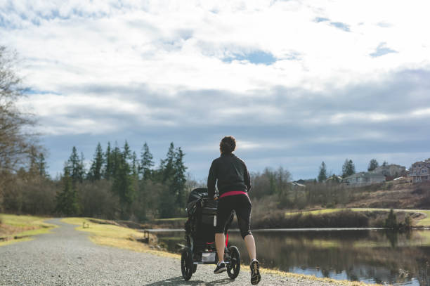 istock Young Hawaiian mom pushing baby stroller outside 641831620