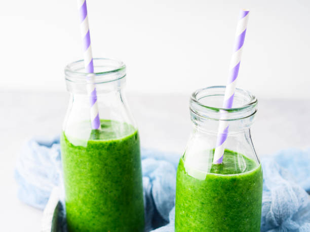 istock Healthy food concept green spinach smoothie breakfast 641832738