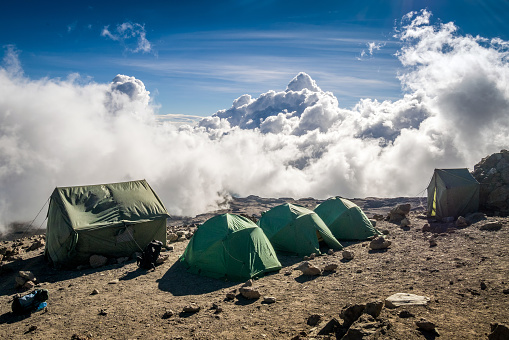 Tents over clouds for people trekking Mount Kilimanjaro, Tanzania