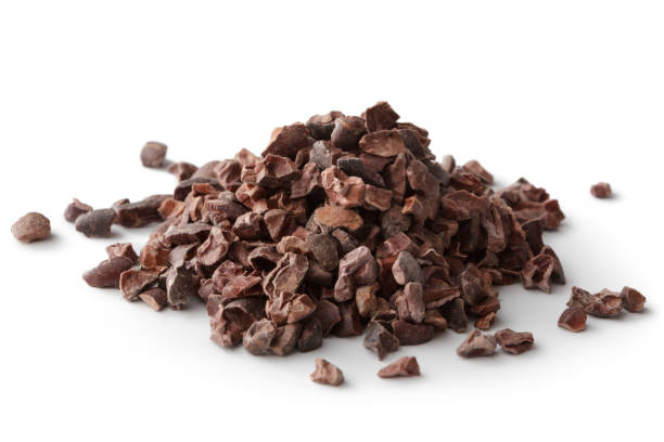 flavouring: cacao nibs isolated on white background - chocolate beans imagens e fotografias de stock