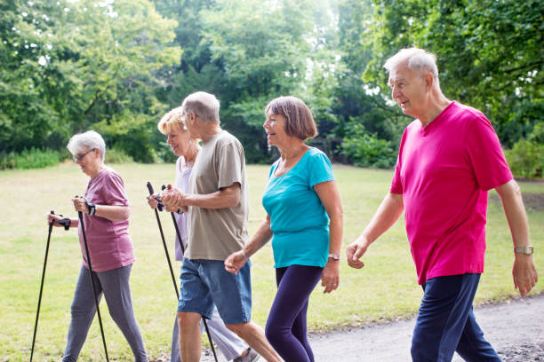 istock Group of seniors walking through park 641833922