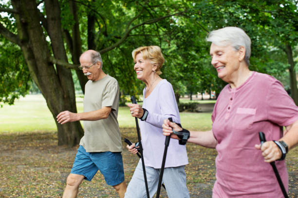 istock Senior people walking in park 641833970