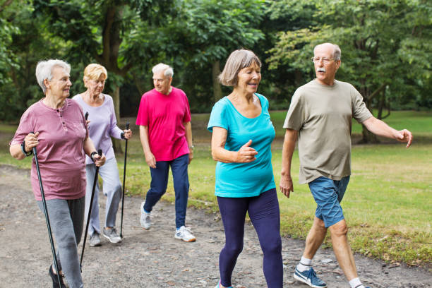 istock Healthy senior people walking in park 641833972