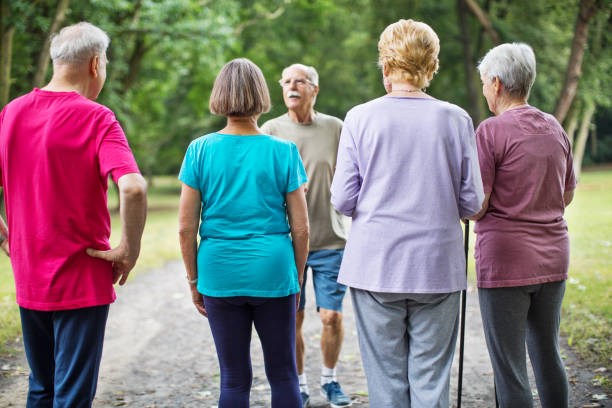 istock Fitness trainer with senior people at park 641834016