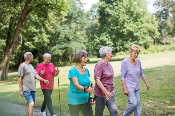 istock Group of senior walking through park 641834352