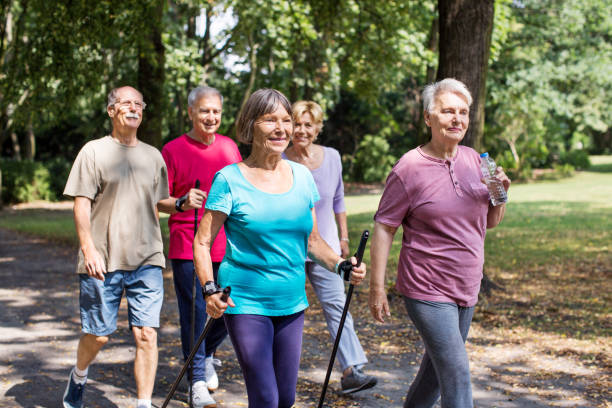 istock Healthy and active senior walking through park 641834356