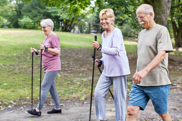 istock Gappy group of senior walking in park 641834392