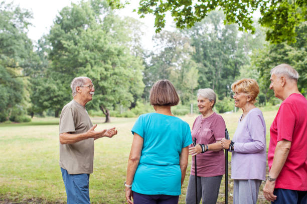 istock Fitness instructor with senior people in park 641834416