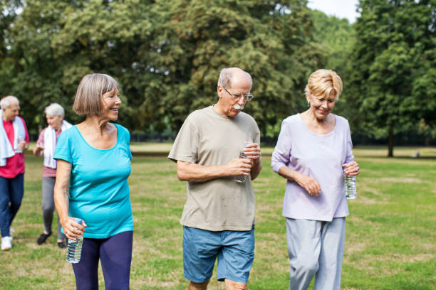 istock Senior people walking in the park 641834570