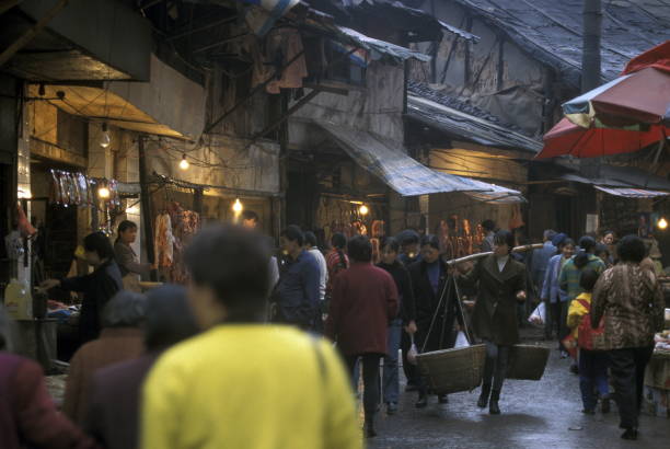 people on the Market streets of Chongqing in the province of Sichuan in china in east asia.