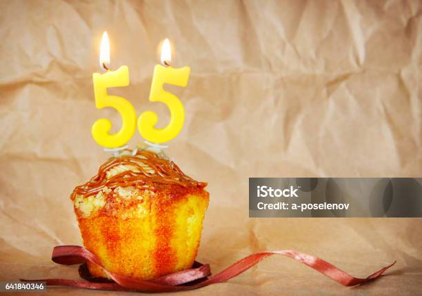 Birthday Cake With Burning Candles As Number Fifty Five Stock Photo - Download Image Now