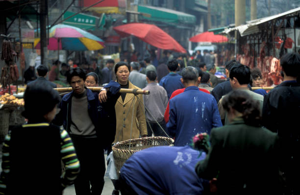 people on the Market streets of Chongqing in the province of Sichuan in china in east asia.