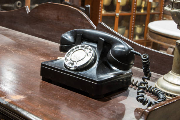 istock Black antique vintage analog telephone dialing. 641840534