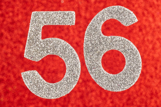istock Number fifty-six silver color over a red background. Anniversary. 641842146