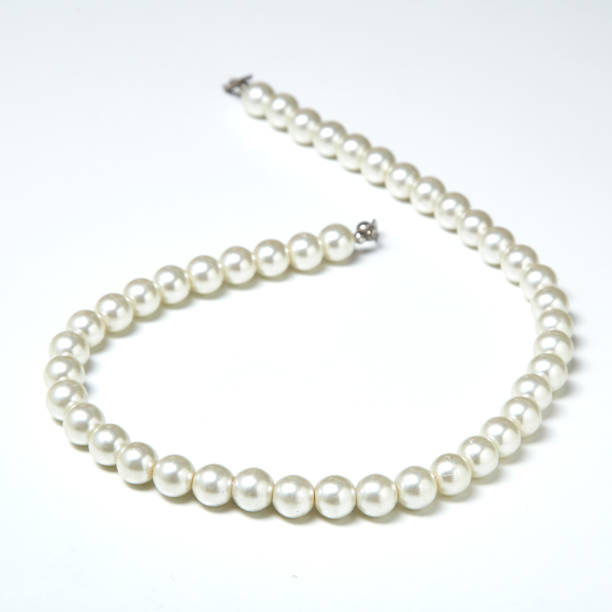 istock pearl necklace isolated on White clouds 641842840