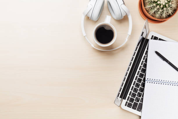 istock Office desk workplace with laptop, coffee and headphones 641845680