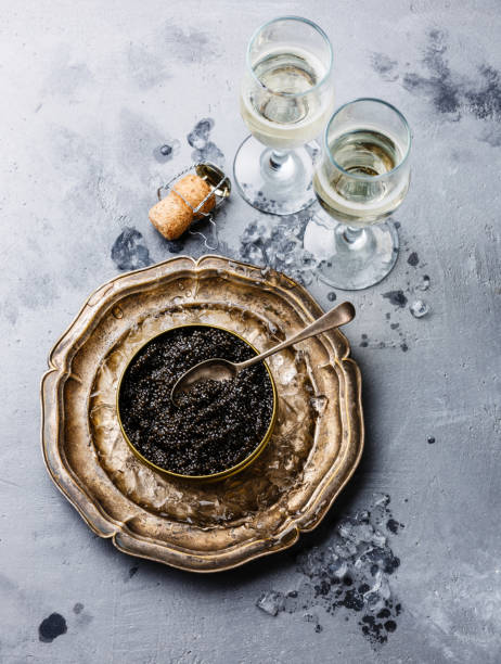 istock Black Sturgeon caviar in can and champagne 641845760