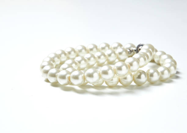 istock pearl necklace isolated on White clouds 641846118