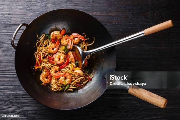 Udon Stirfry Noodles With Shrimp And Vegetables In Wok Pan Stock Photo - Download Image Now