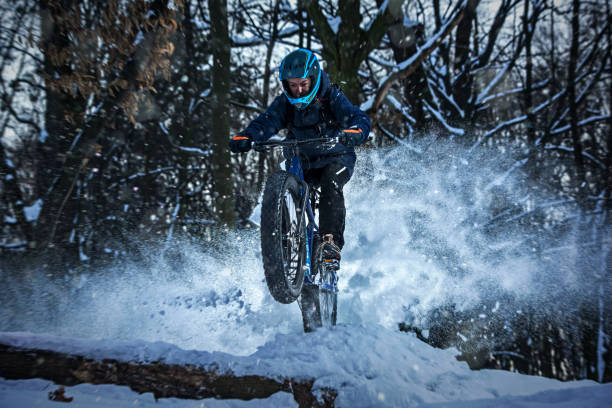 istock Man rides fat bike in the forest 641855628