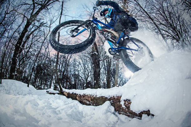 istock Man rides fat bike in the forest 641855642