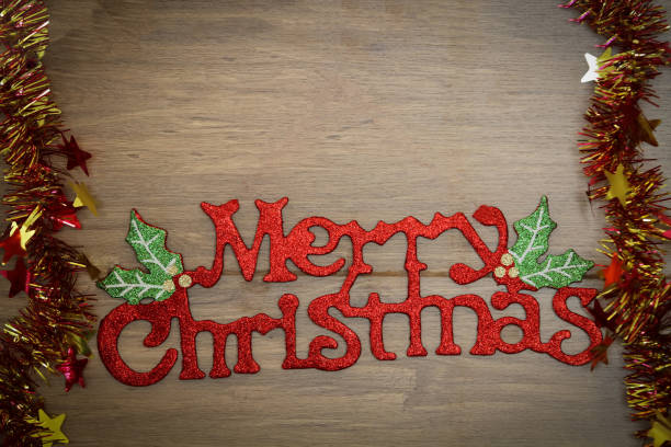 istock Merry Christmas Gingerbread words  on wooden background 641860130