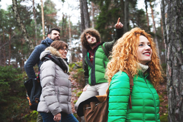 istock Group of friend walking into wood 641860174