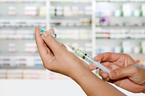 Hands the doctors filling a syringe on store medicine and pharmacy drugstore for background stock photo