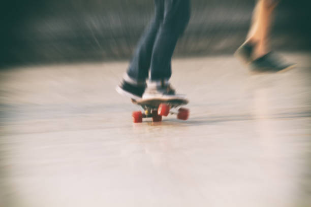 istock motion blur of Skateboarder doing a skateboard trick on wall 641863888
