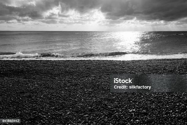 Black Pebbles Beach On Greek Island Of Chios Stock Photo - Download Image Now - Aegean Sea, Back Lit, Beach