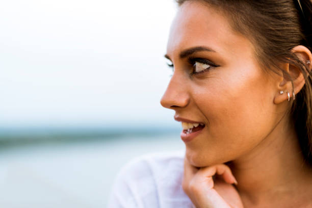 istock Beautiful young woman profile shot 641865778