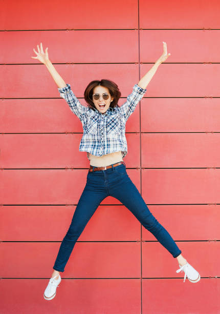 istock Jumping happy girl 641866000
