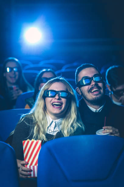 istock Happy couple watching movie together 641868074