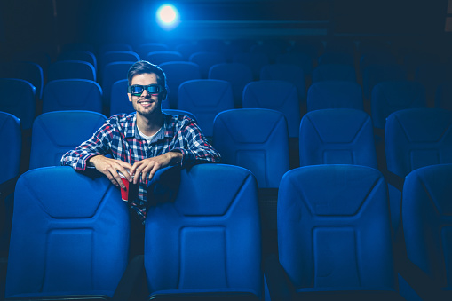 Man watching movie at cinema,front view