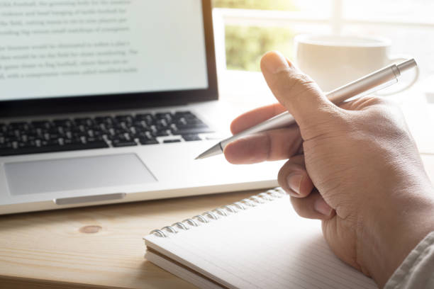 istock Hand writing on notebook with laptop.Inspiration moment 641868318
