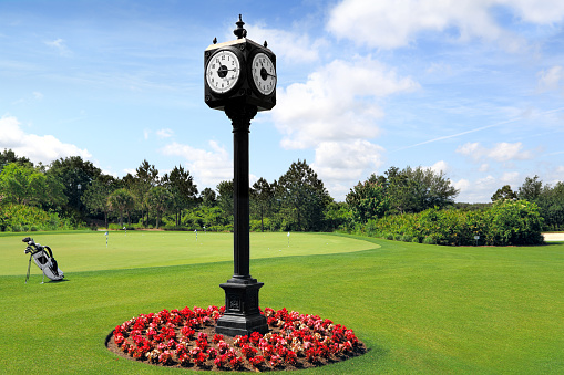 Outdoor Clock Post on golf course with green spring valley on the background