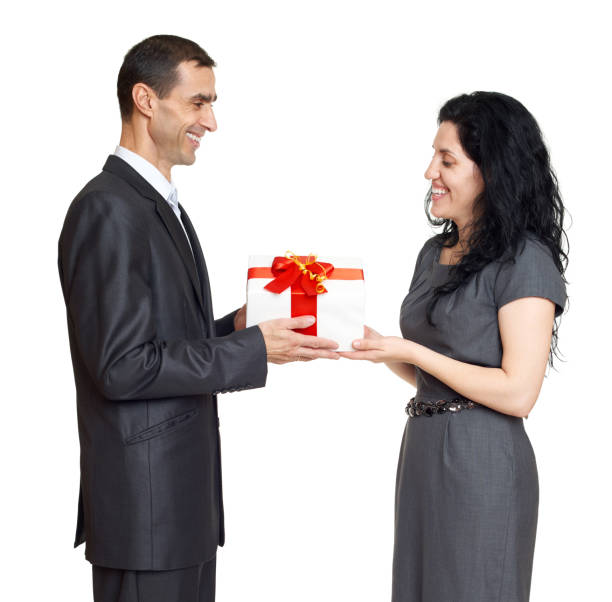 istock romantic couple with box gift, dressed in black suit 641871644