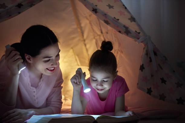 istock Mom and child are reading book 641871862