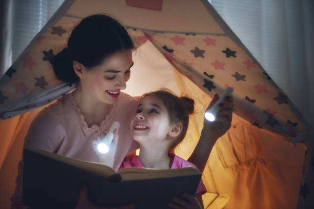 istock Mom and child are reading book 641871992