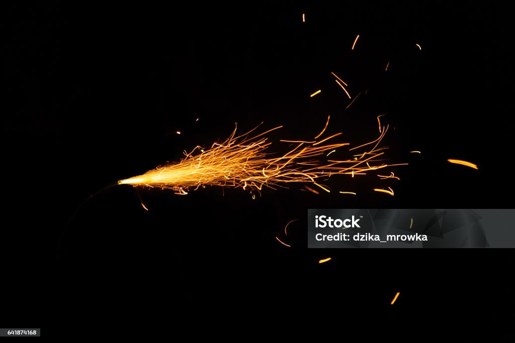 Burning fuse on black background Sparks Stock Photo