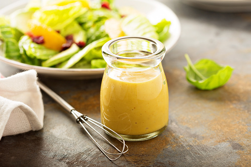 Homemade honey mustard salad dressing in a jar