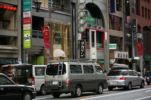Tokyo, Japan - March 24, 2009: traffic jam in rush hour in the streets of Ginza on a background of buildings with advertising and signs, Tokyo.