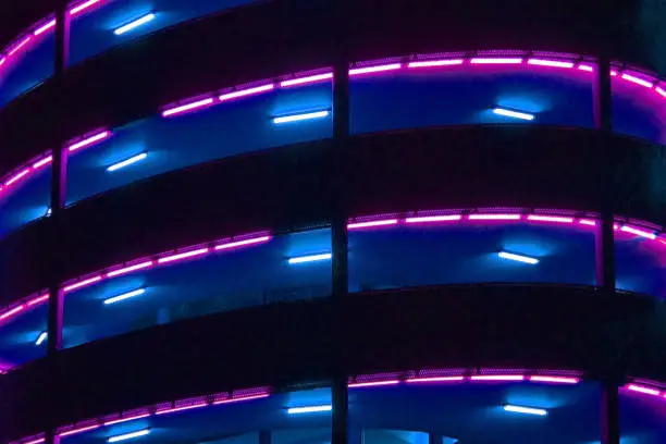 Abstract lighting on the multi storeys of a car park viewed from street level in Bristol. This is at Cabot Circus on the eastern edge of the city.