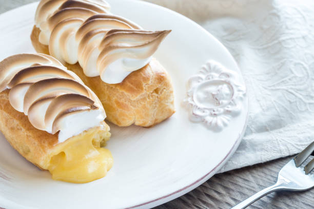 istock Eclairs with lemon curd and meringue 641884808