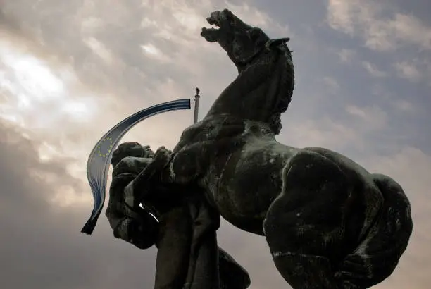 Monument and the flag of the European Union as a symbol of attempts to preserve Europe alive, at the front of the Assembly of the Republic of Serbia