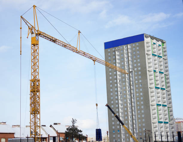 istock Construction cranes used in the construction of multi-storey buildings 641891416