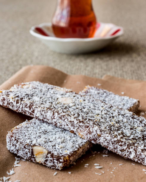 istock Turkish Dessert Cezerye with walnut, coconut powder and tea. 641891552