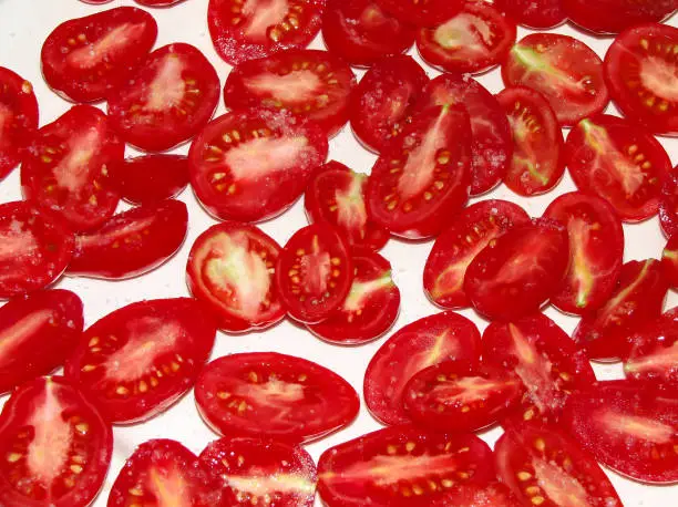 Photo of Halved red tomatoes on a platter